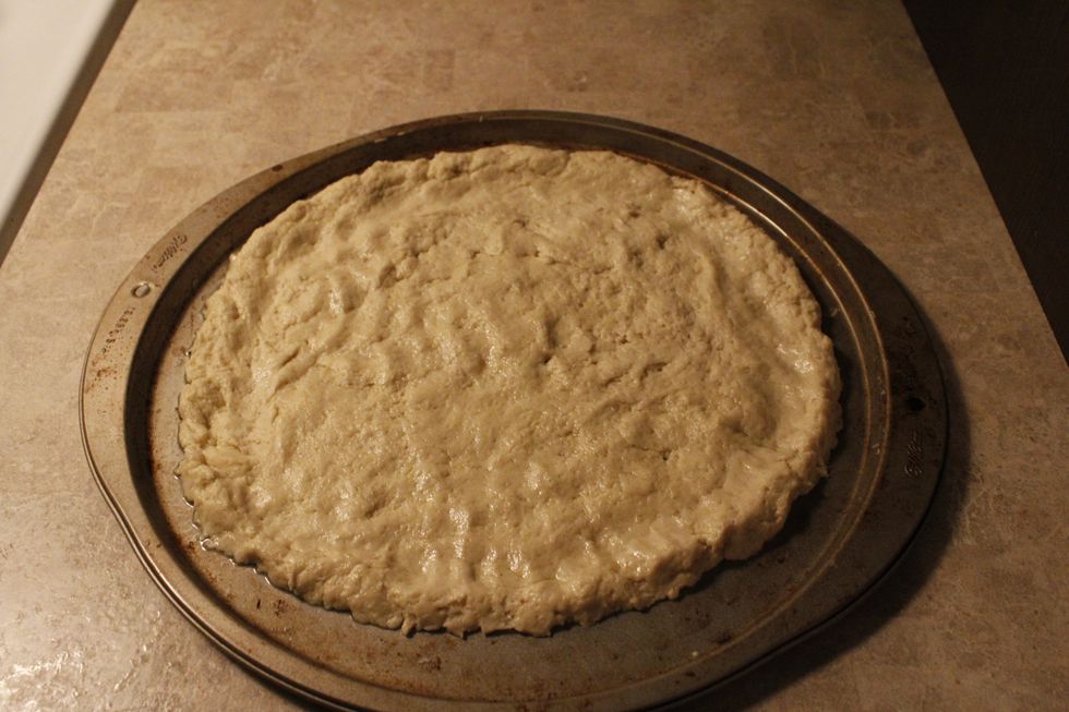 Spread out of ball of dough on a baking sheet. Prep the baking sheet with a small amount of olive oil to prevent sticking. Bake for 5-7 minutes at 350 degrees.