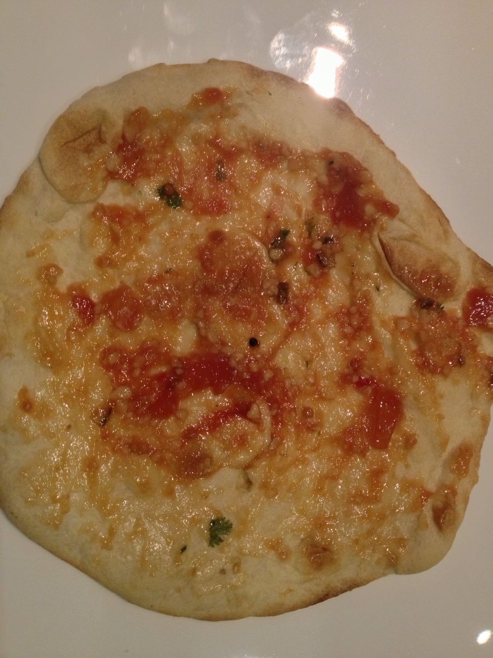 Spread out over the naan bread