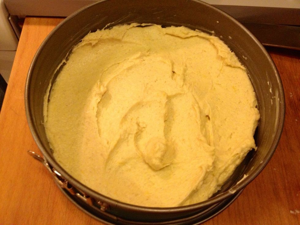 Spread out the batter in a greased cake pan.