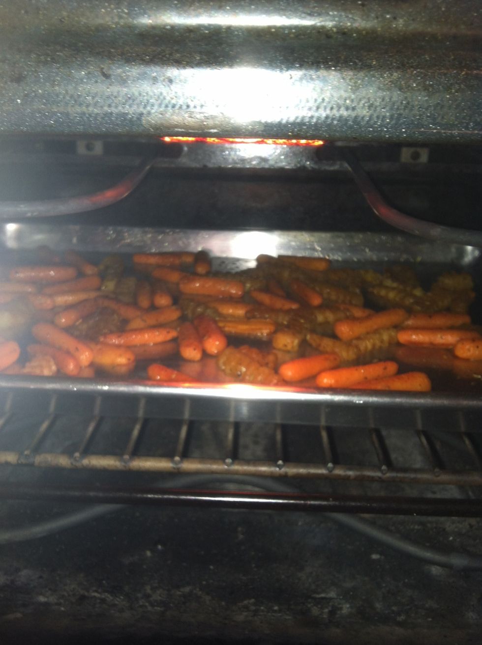 Spread out the carrots and potatoes and place back into the oven. However, you can roast them until they are to your desired liking. I just like my roasted carrots golden w/ a carmely crunch :)
