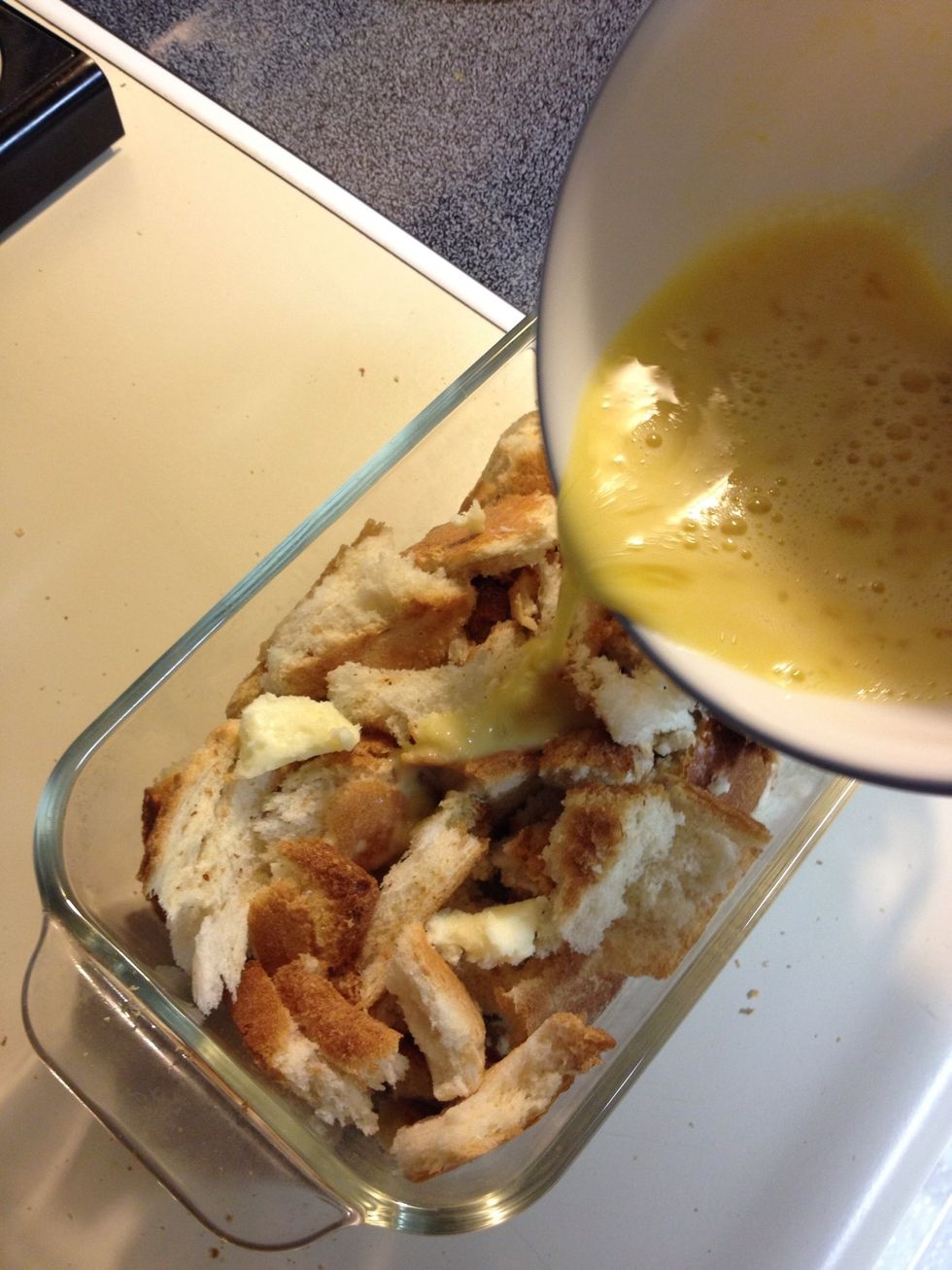 Spread out the egg mix over the bread. Don't pour at just one spot..