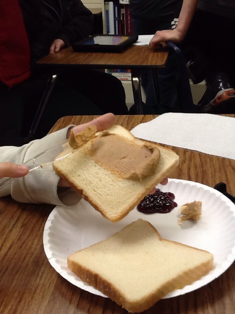 Spread peanut butter lightly to one side.