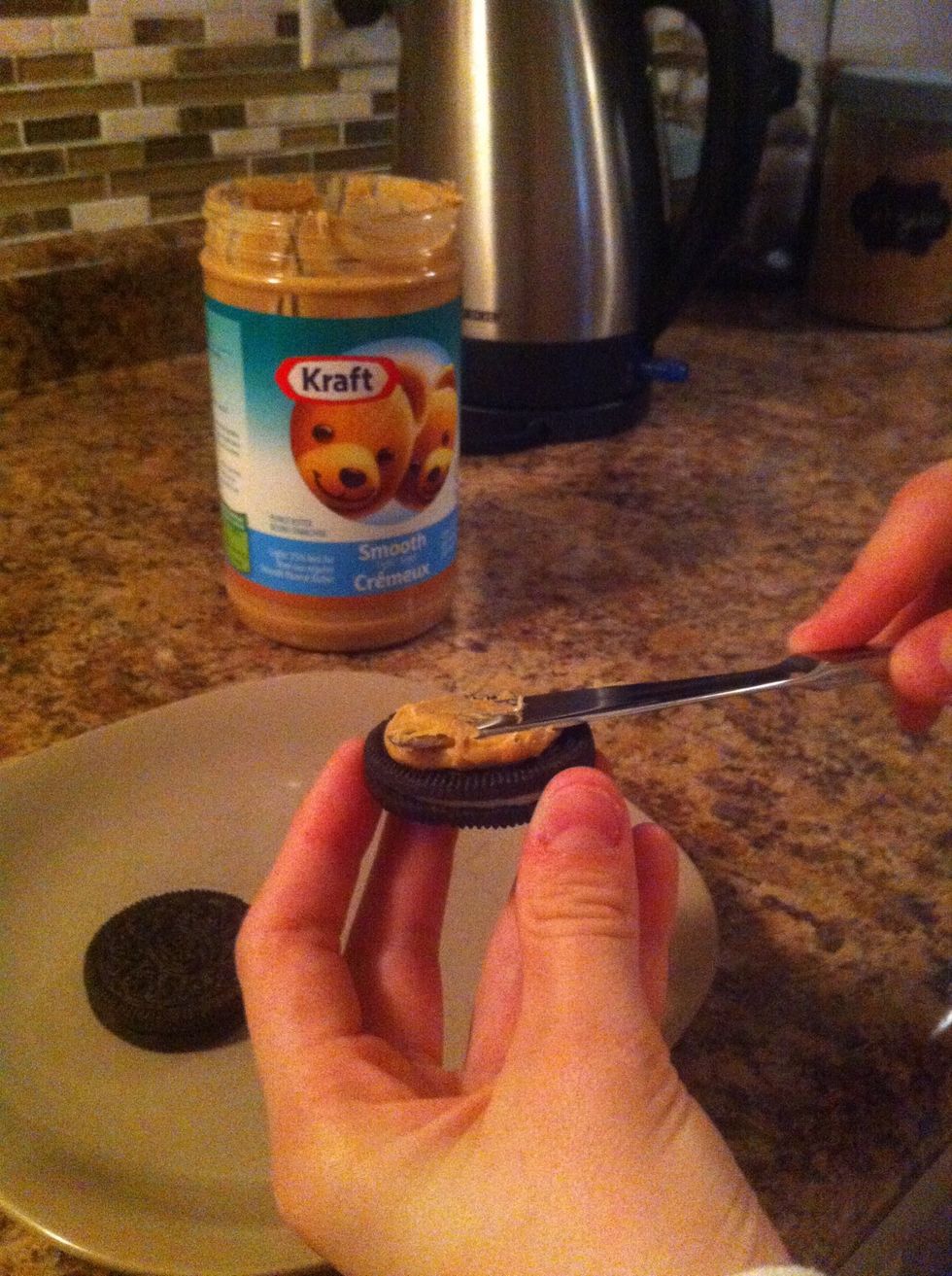 Spread Peanut Butter on Oreo.