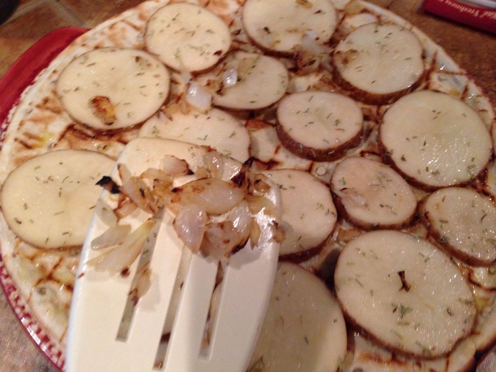 Spread potato slices onto crust in a single layer. Top with the onions.