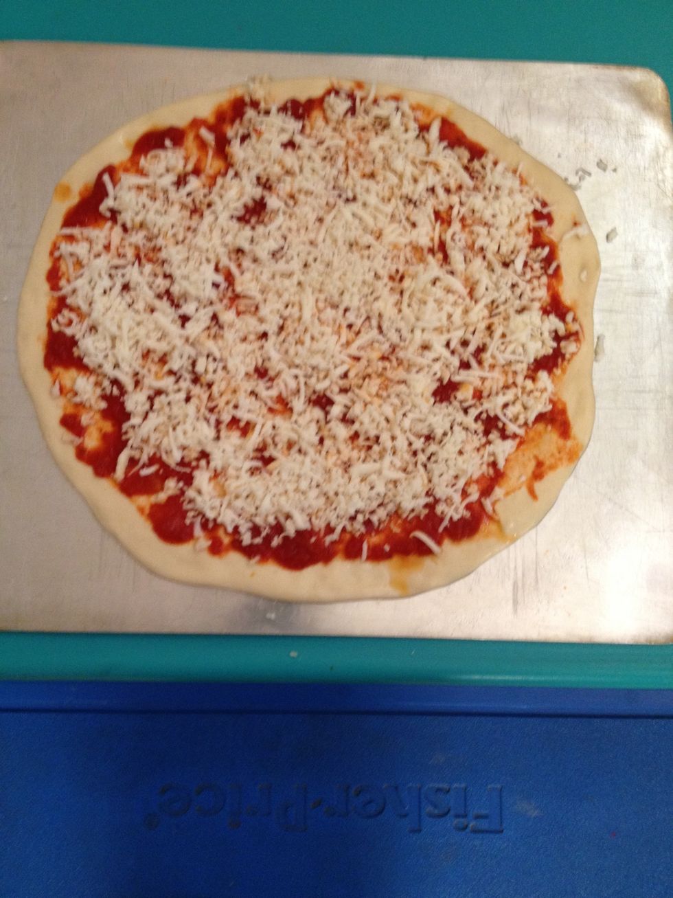 Spread sauce and cheese over pizza. If you want a plain pizza, this is it!