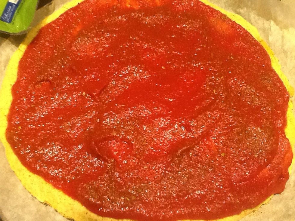 Spread sauce.  Sprinkle with about a teaspoon of seasoning mixture.