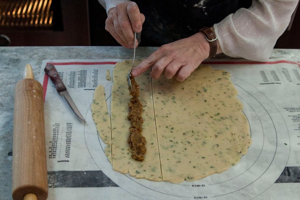 Spread some bacon jam down the center of each strip.