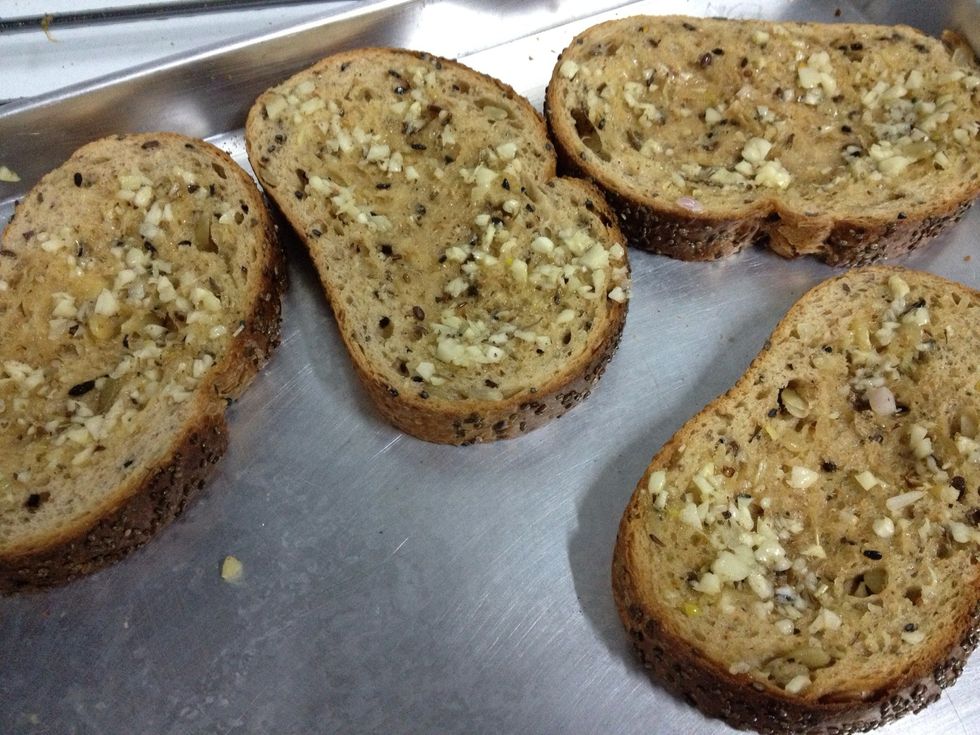 Spread some garlic butter on bread and toast them it the oven lightly
