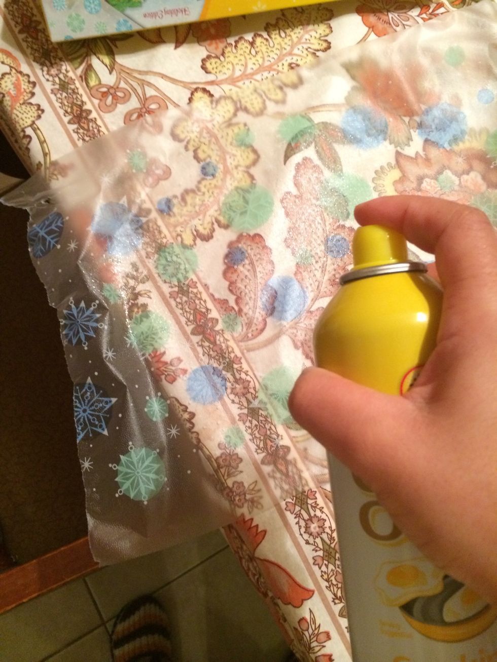 Spread some oil of any type on the plastic wrap. The ones in a can are wonderful here.