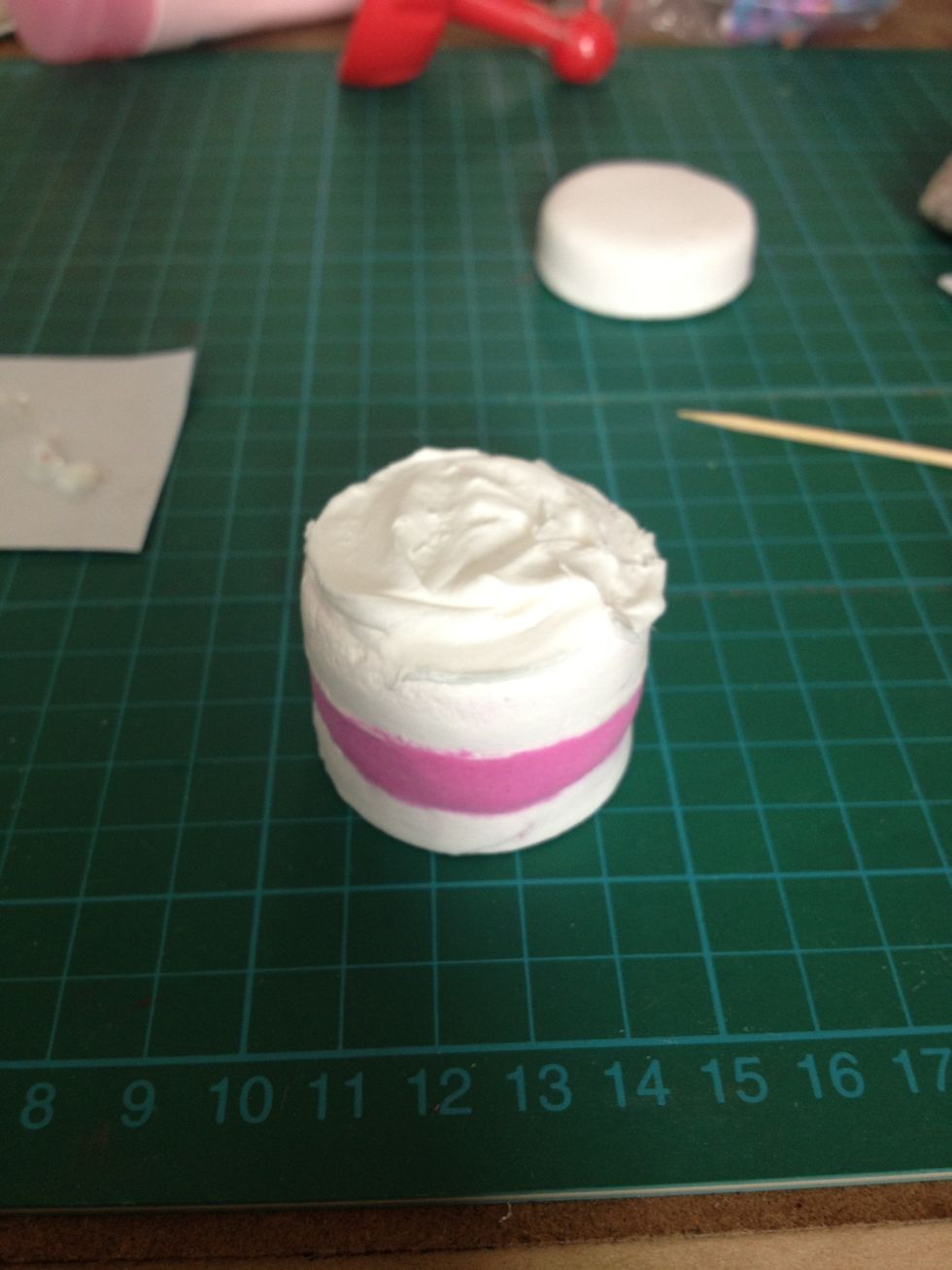 Spread some white clay irregularly on top to create a cream look.