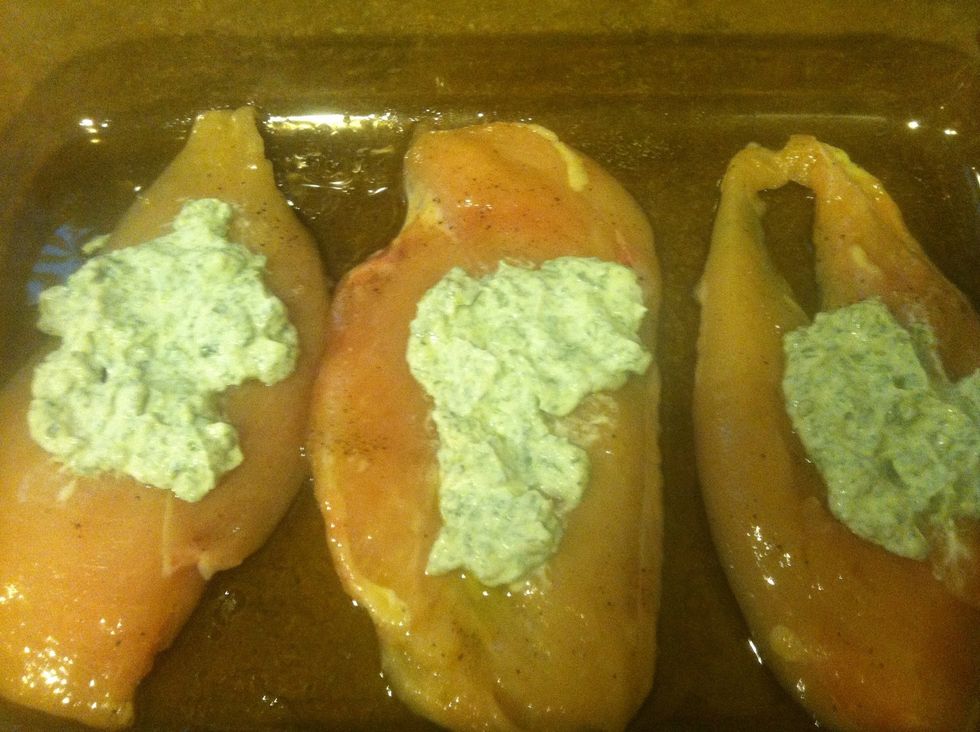Spread spinach onto chicken breasts
