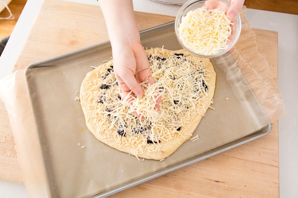Spread that cheese all over - including the edges!