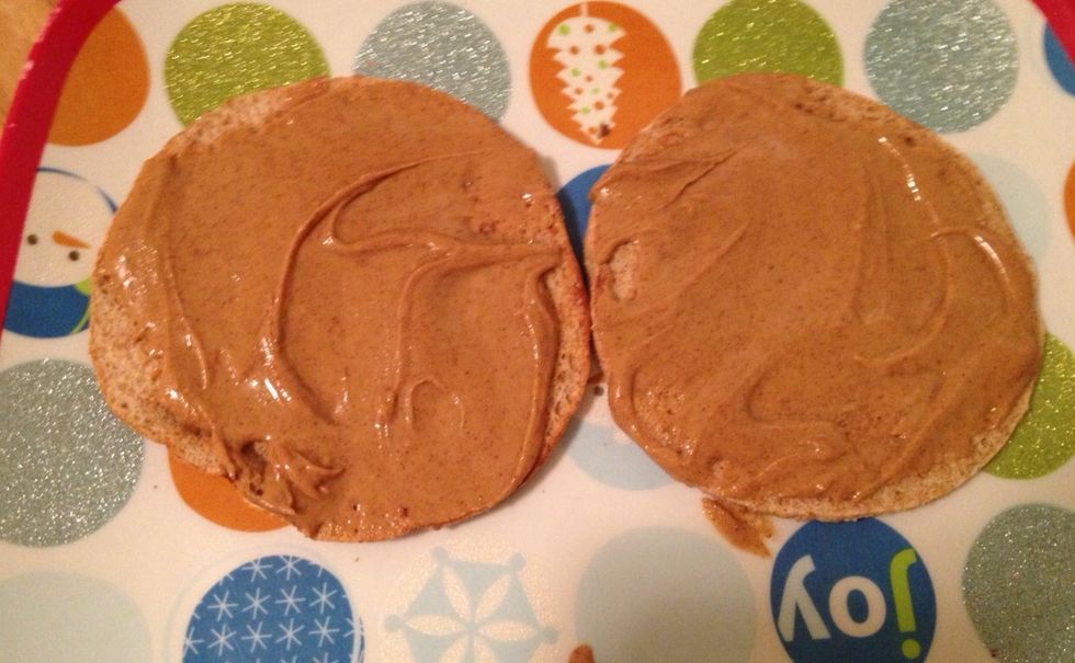 Spread the almond butter evenly on the bread