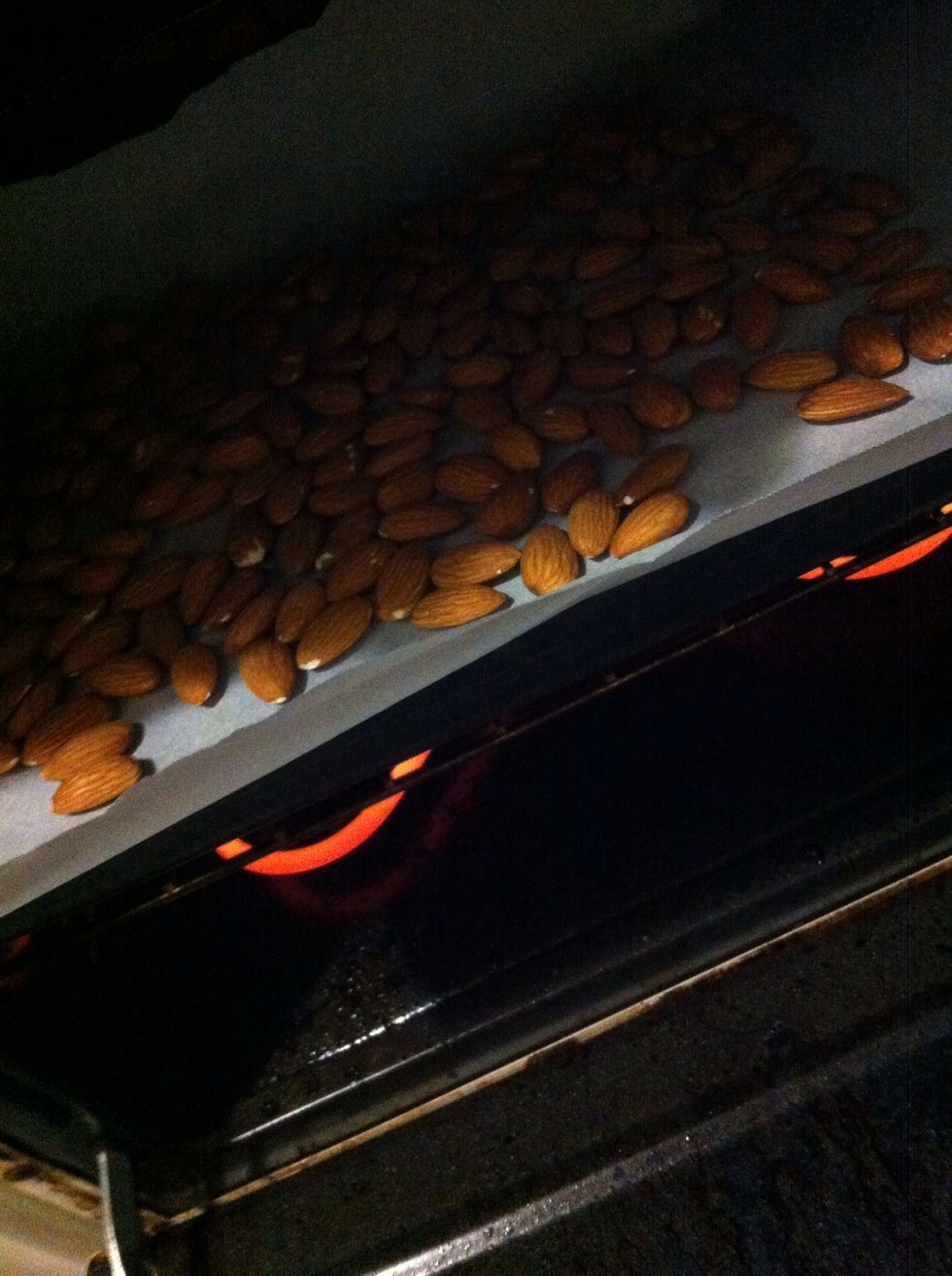 Spread the almonds out evenly over the baking paper on your cookie sheet - roast for about 10 minutes on 360F (checking/turning regularly so they don't burn !)