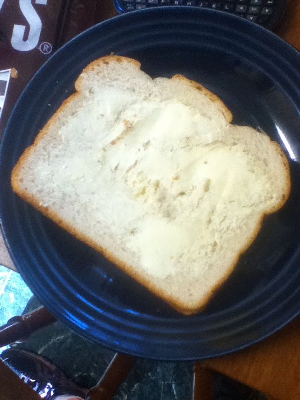 Spread the butter onto the bread as thick as you want it.