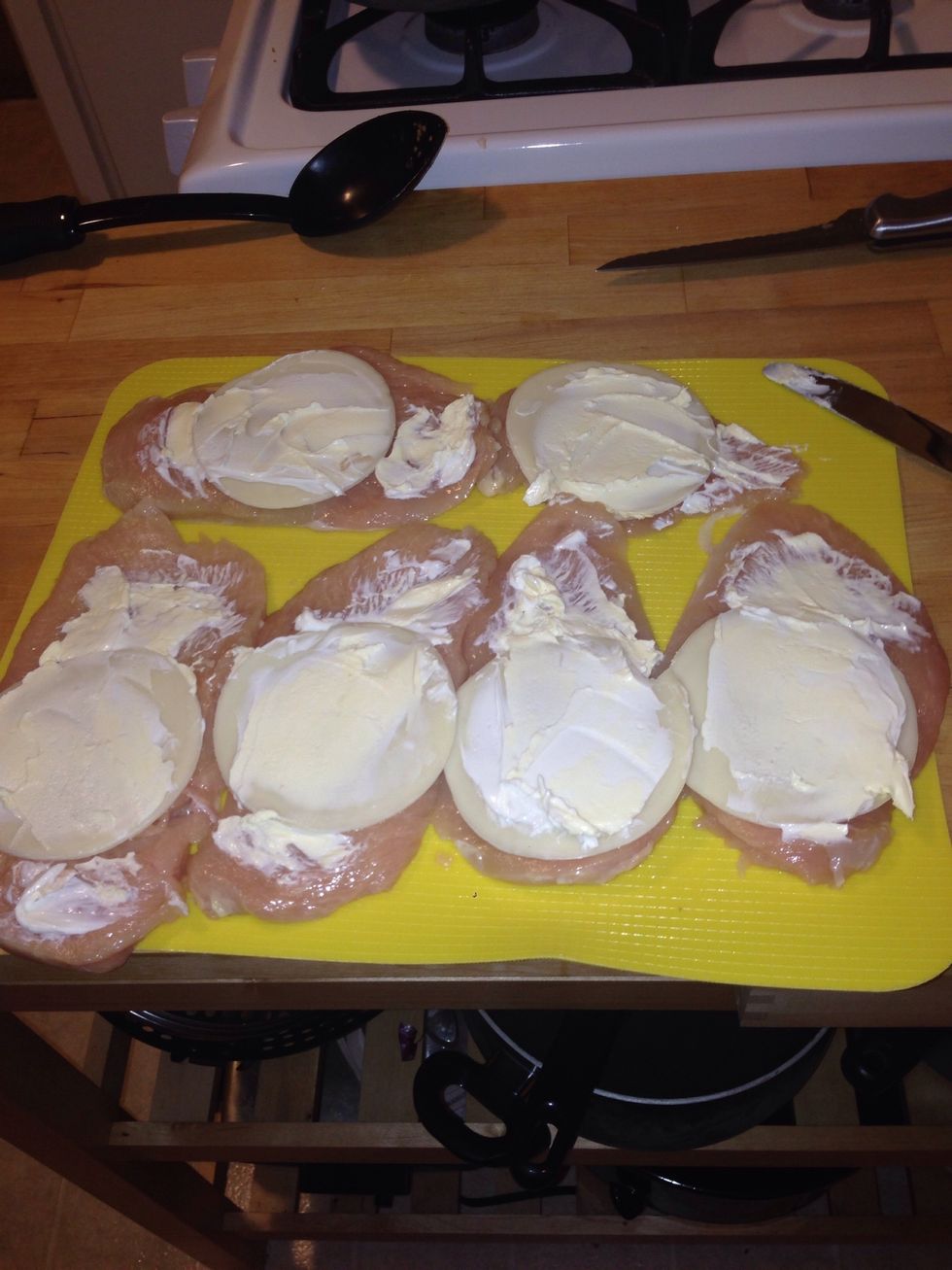 Spread the butter out on the chicken.