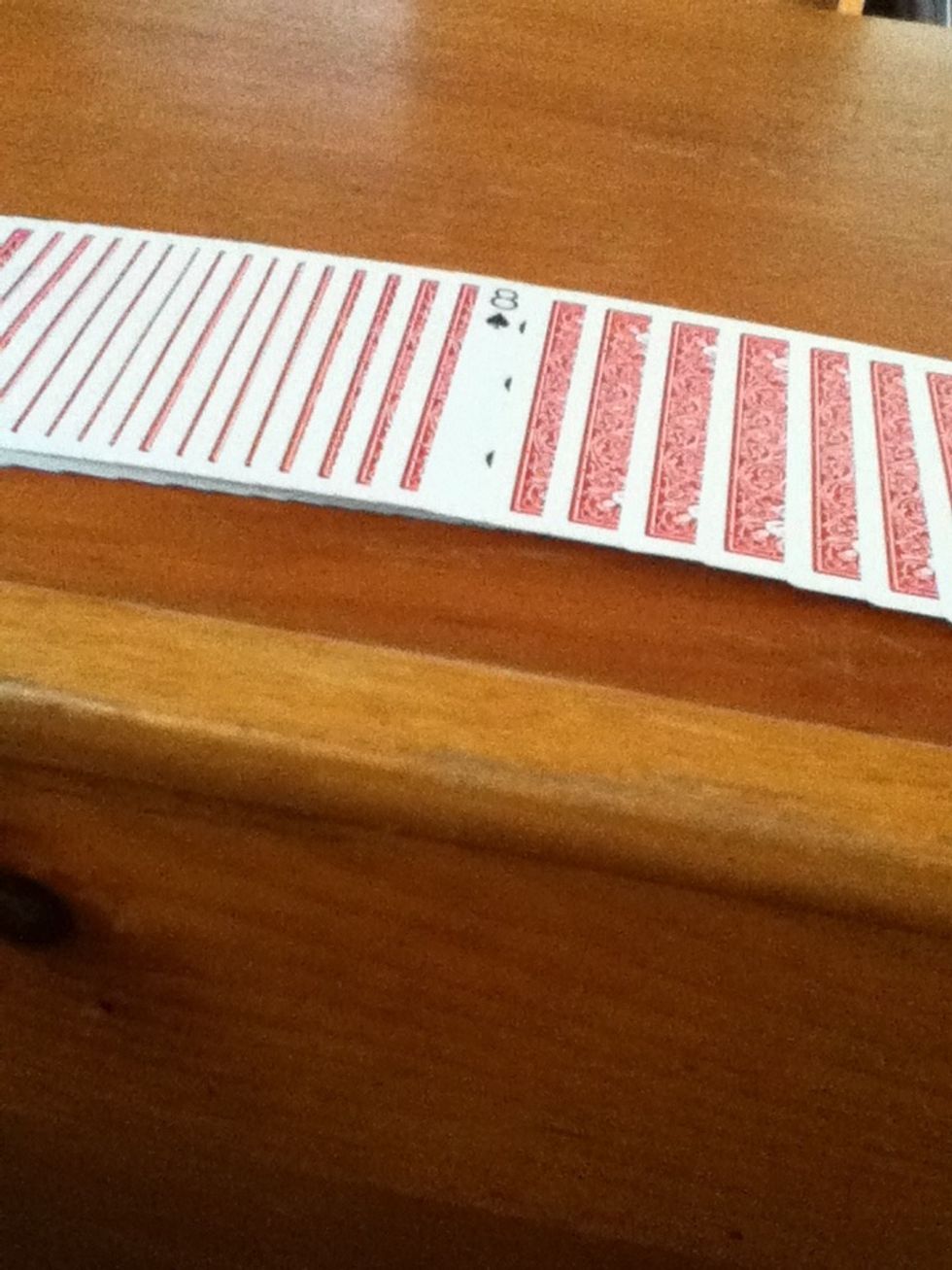 Spread the cards out and you should see the spectators card.