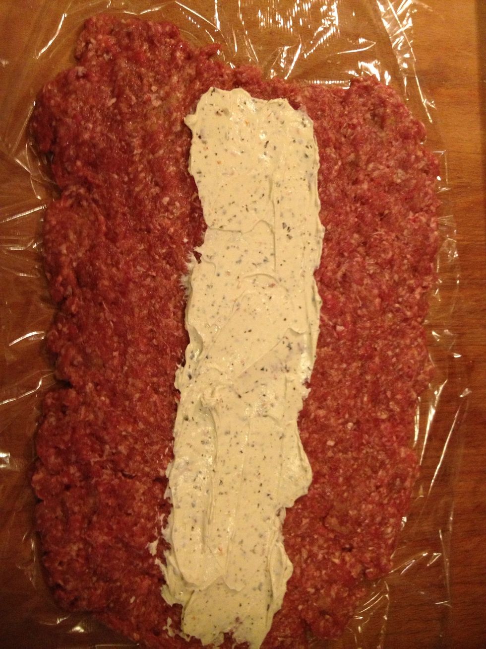 Spread the cream cheese on top of the meat. I used cream cheese flavoured with tomato & pesto. If you prefer you can use regular cream cheese and add some kind of flavouring on your own.