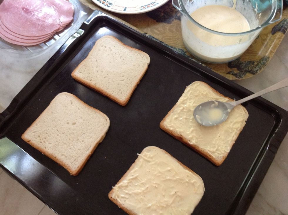 Spread the cream mixture on each slice with a large spoon.