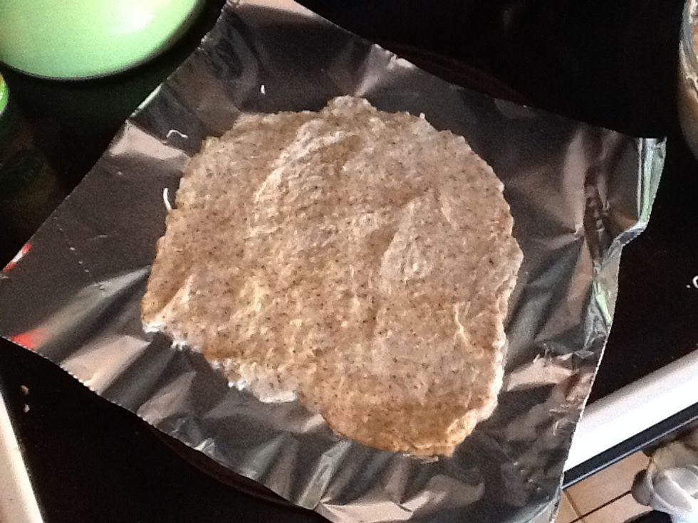 Spread the dough onto a piece of foil that has been sprayed w/nonstick spray. It does not matter the shape you make it or thickness. I do an 1/8-1/4 of an inch, but I don't pull out my ruler either.