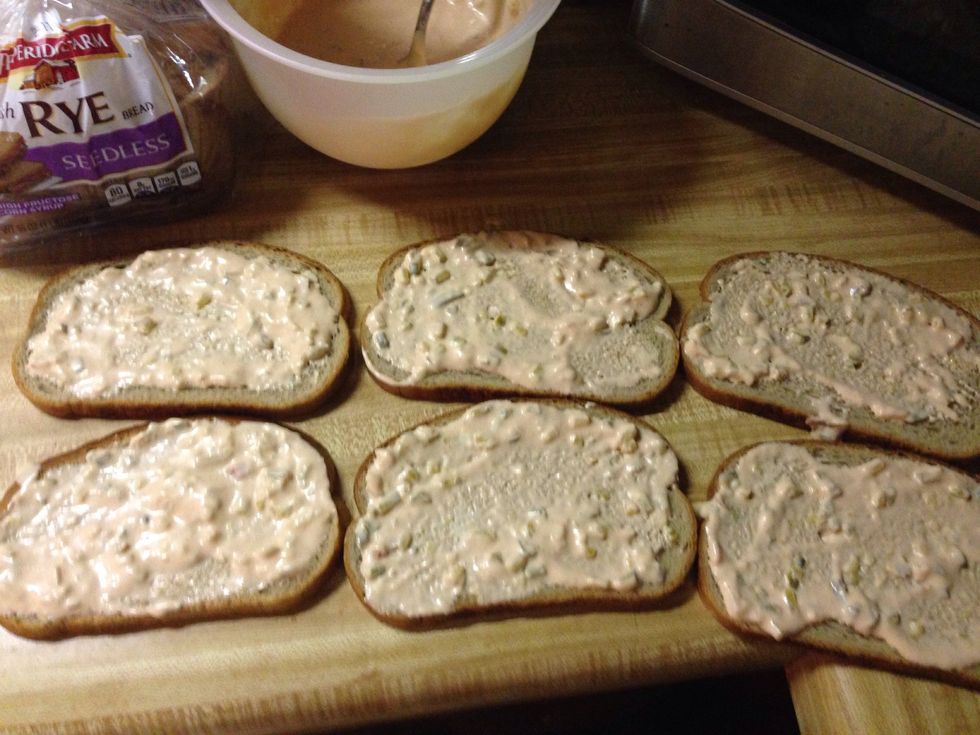 Spread the dressing out over each slice of bread. Don't glob it on. Just a thin layer will do.
