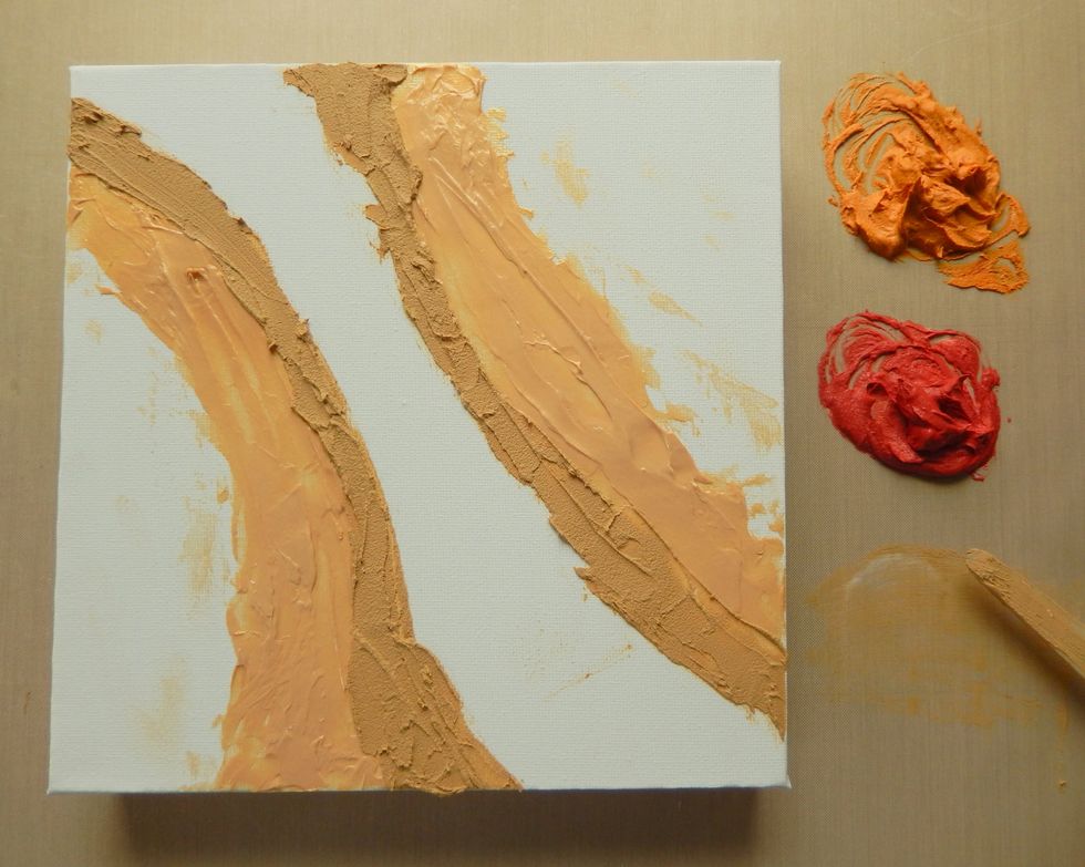 Spread the embossing paste mixed with the Potting Soil Archival Reinker inside the Gold paste lines.
