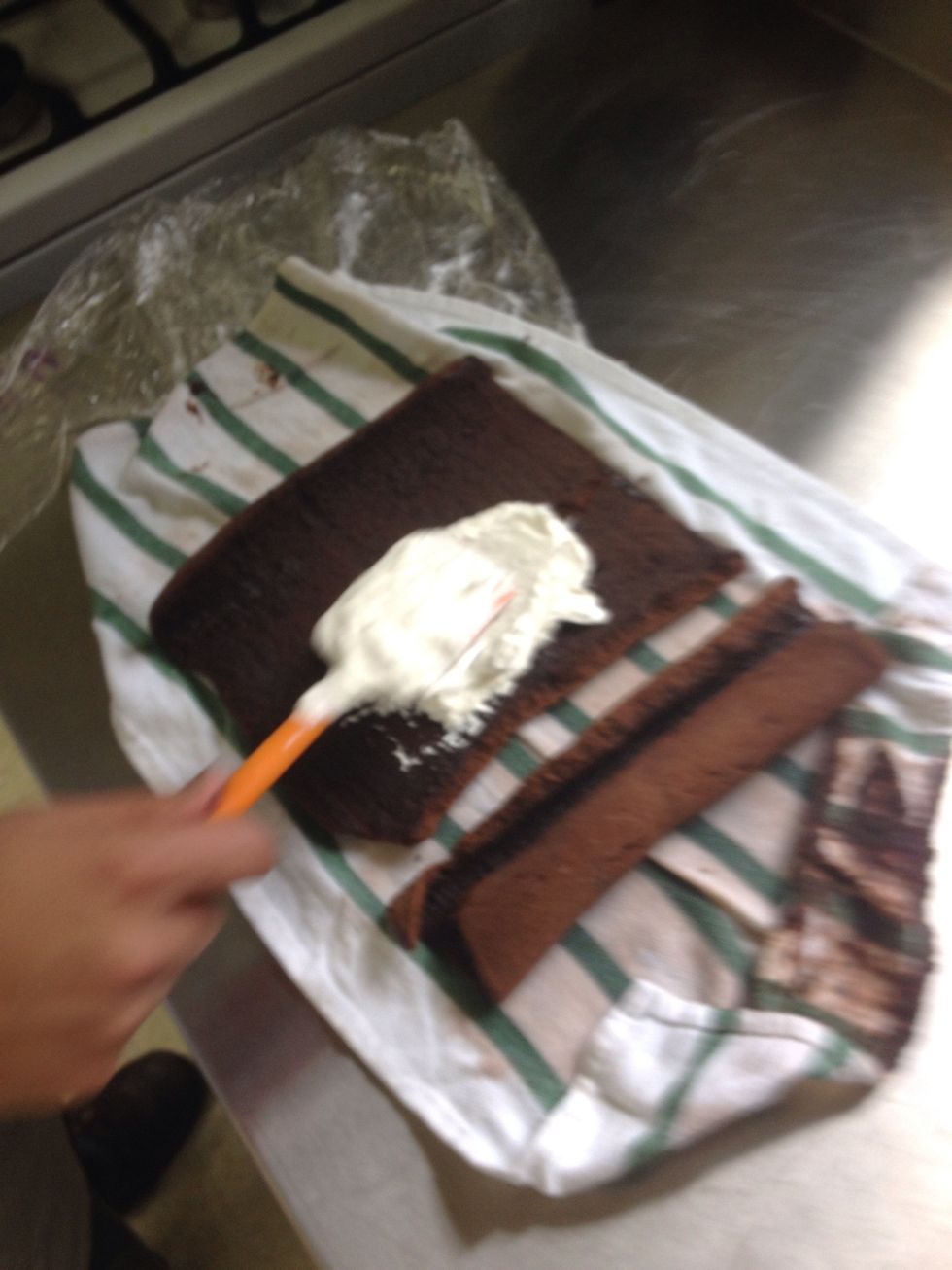 Spread the filling evenly onto the cake, about an inch thick. There will be some filling left over