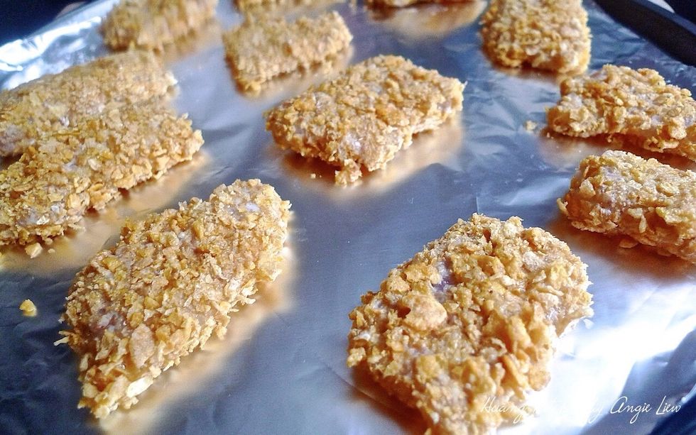 Spread the fish pieces in a single layer on the prepared baking tray.