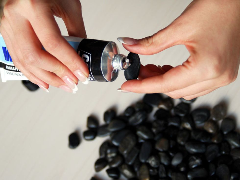 Spread the flat side of the stones with epoxy or superglue.