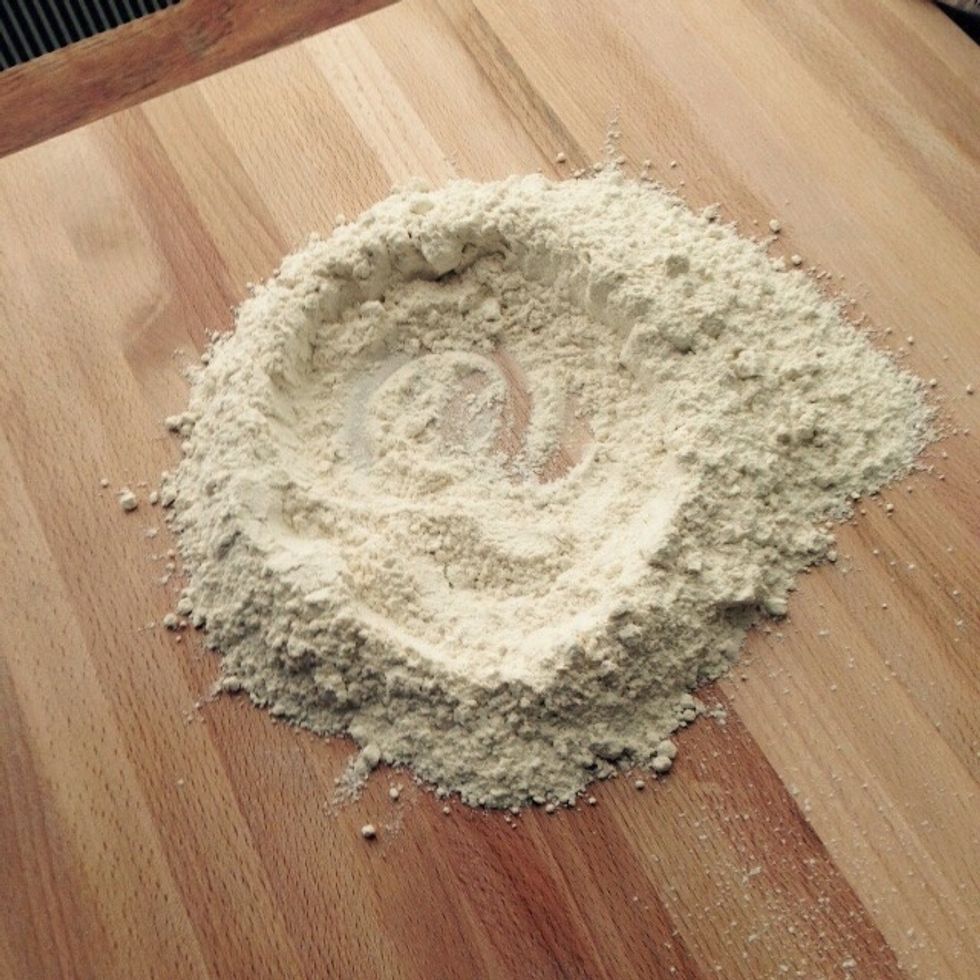Spread the flour on a board