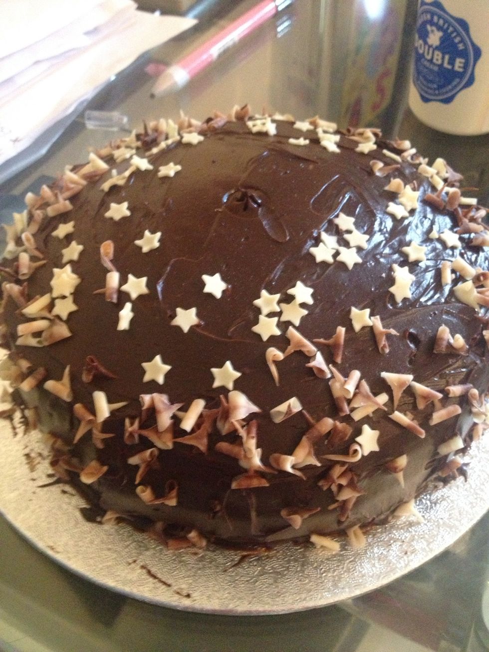 Spread the frosting all over the cake and add decorations. I like to leave the cake again for an hour to set in its position before tucking in.