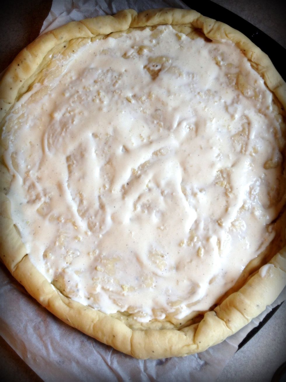 Spread the garlic ranch mixture over the crust.
