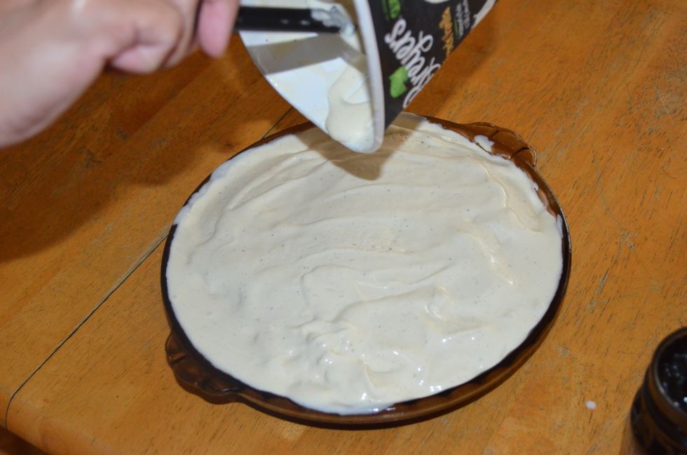 Spread the ice cream over the Oreos until it covers the pie plate. You may need to use to whole container
