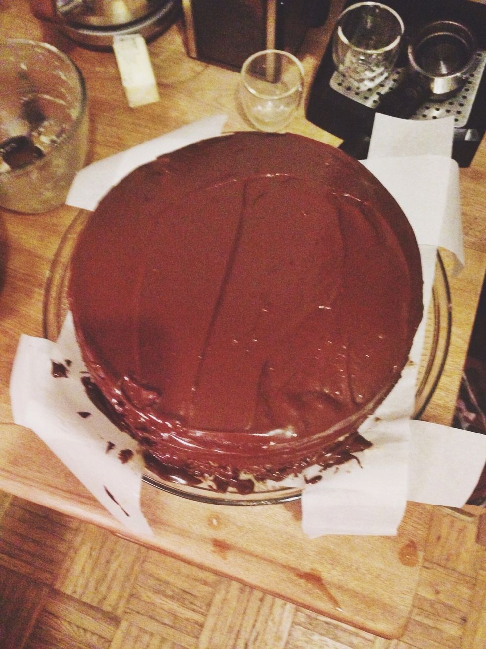 Spread the icing on the top and around the sides of the cake.