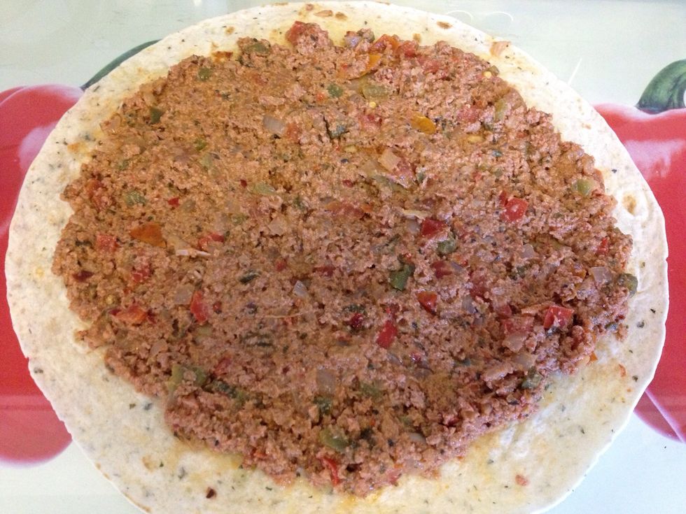 Spread the mixture in top of the tortilla With spoon