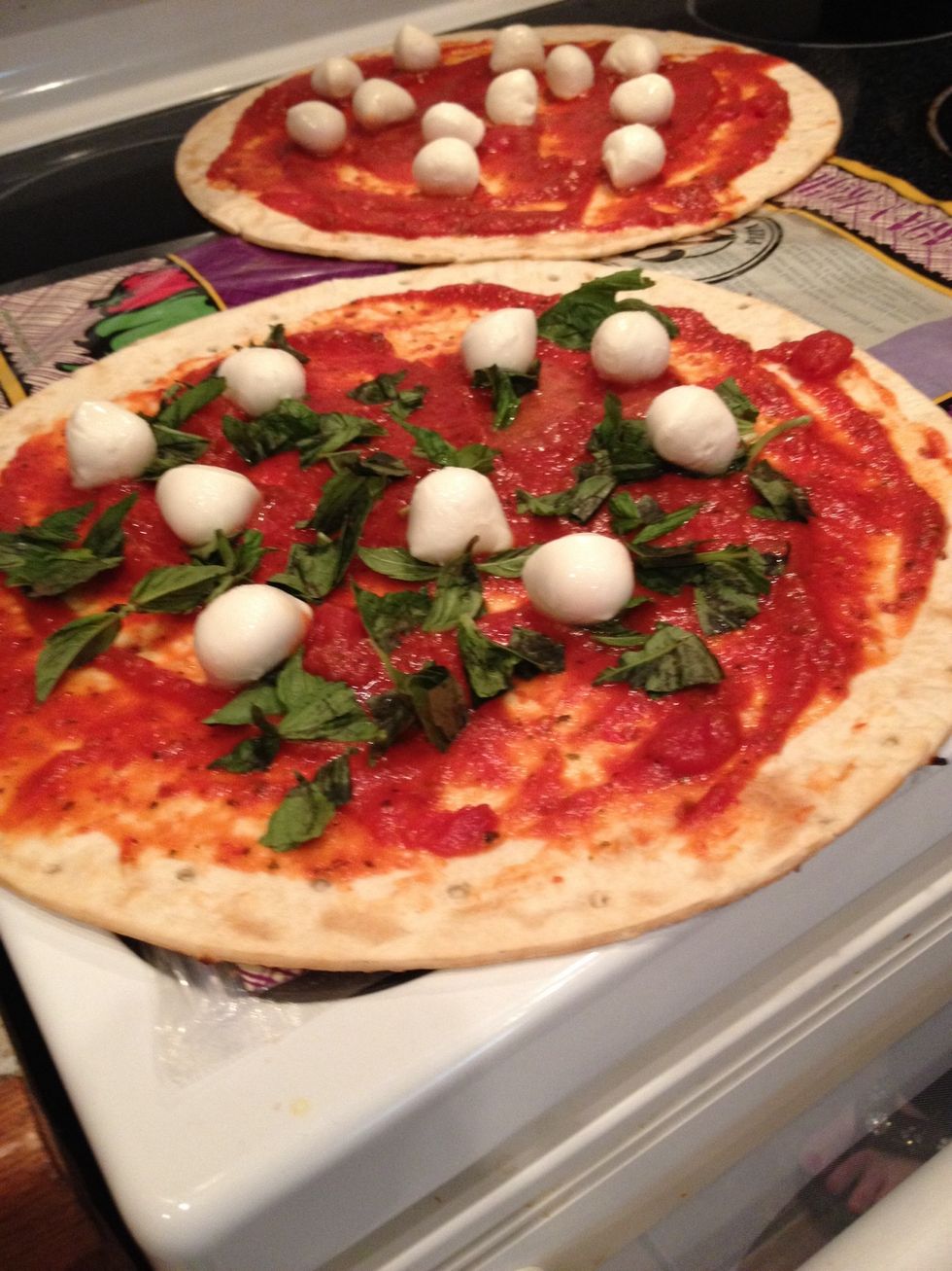 Spread the mozzarella over the pizza