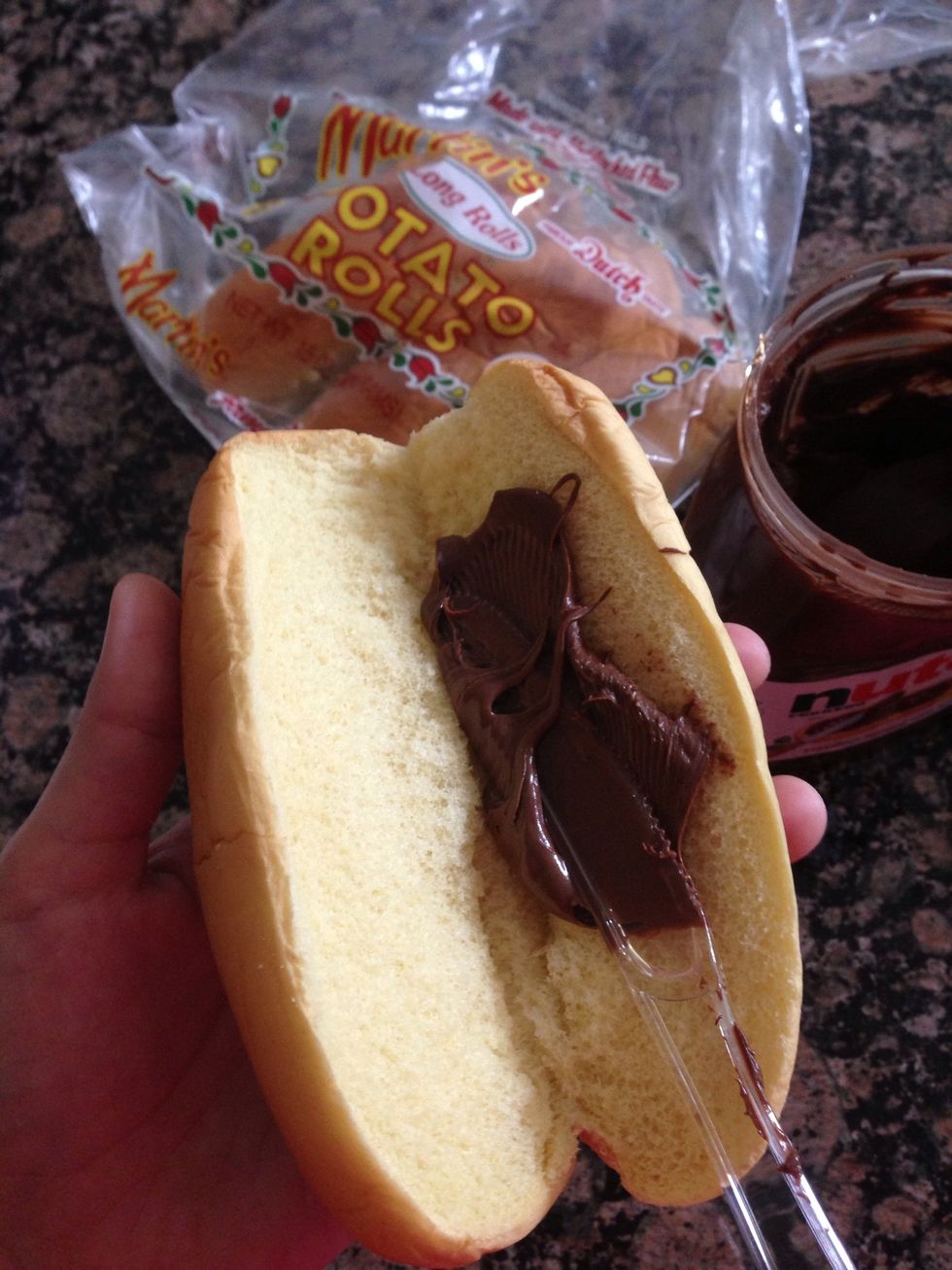 Spread the Nutella on to your roll.