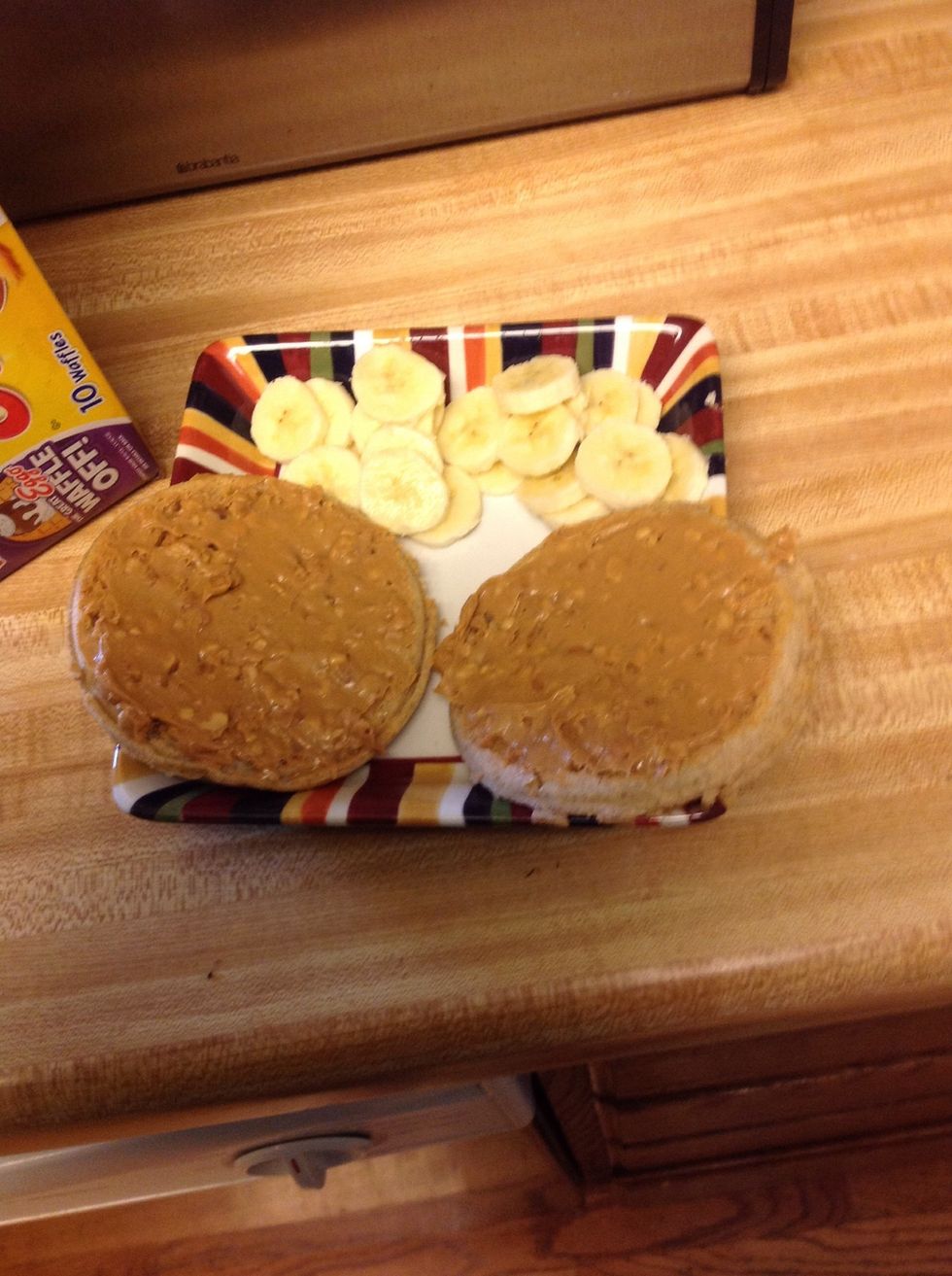Spread the peanut butter on the waffles(be careful the waffles might be hot)