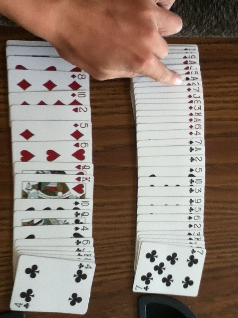 Spread the piles out and show there all in the right order, except there card.