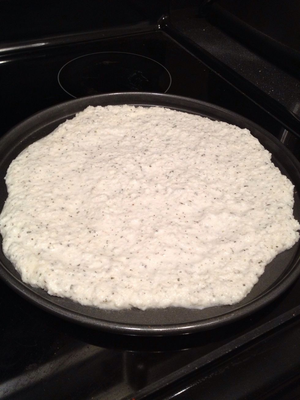 Spread this out on an oiled down pizza tray. Try to keep it level so one part doesn't cook faster than another.