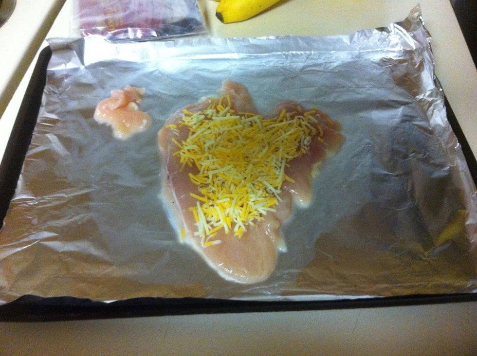 Spread whatever cheese you want on it along with whatever spices you want. I used red pepper and oregano. My cheese was Colby jack.