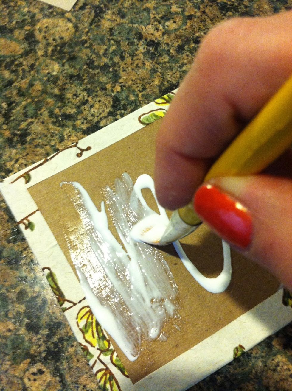 Spread with paintbrush to prepare surface for inside cover paper