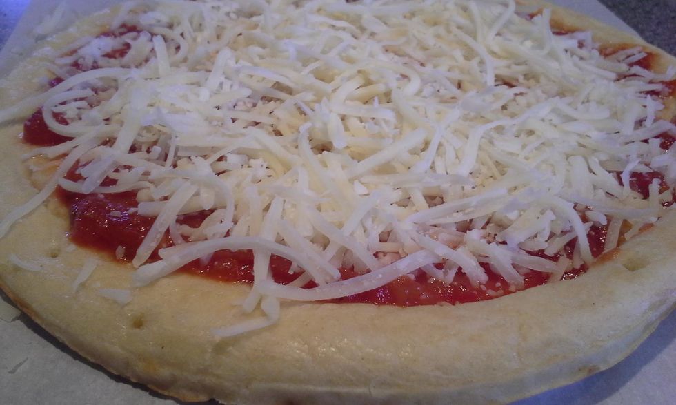 Spread your cheese over the sauce.