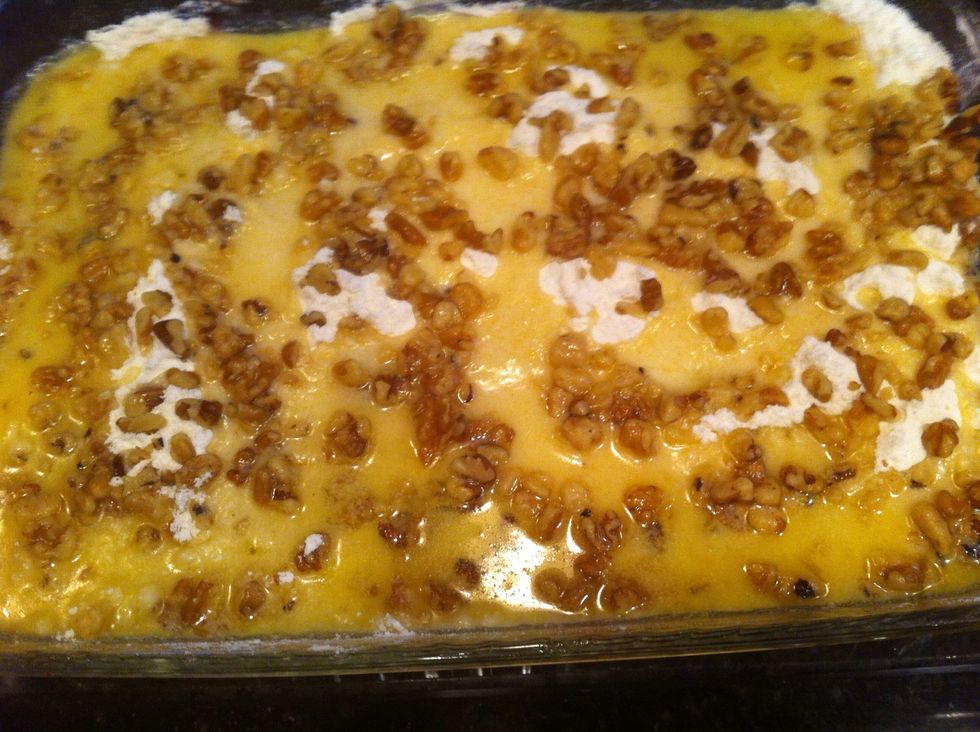 Sprinkle 1/2 cup walnuts on top, then pour 2 sticks melted butter on top & sprinkle 1/2 tsp salt on top...bake at 350 for 35-45 min until lightly browned :)