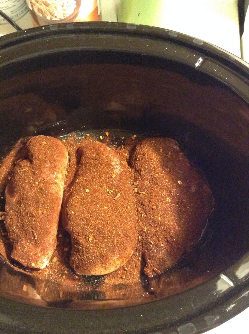Sprinkle 1/4 cup of taco seasoning over the chicken. (I don't use the package of taco seasoning. It has high sodium, so I get it from bulk containers from the store.)