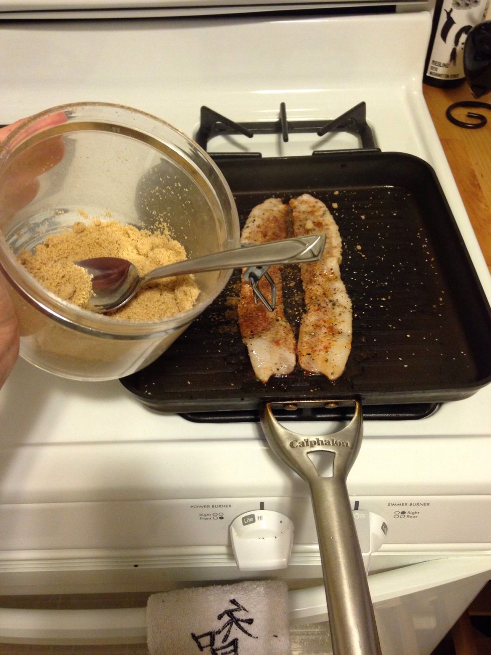 Sprinkle 1/4 tsp of brown sugar. When you flip the bacon, repeat the 1/4 tsp on the other side. This should take around 2-4 minutes depending on how crispy you like your bacon.