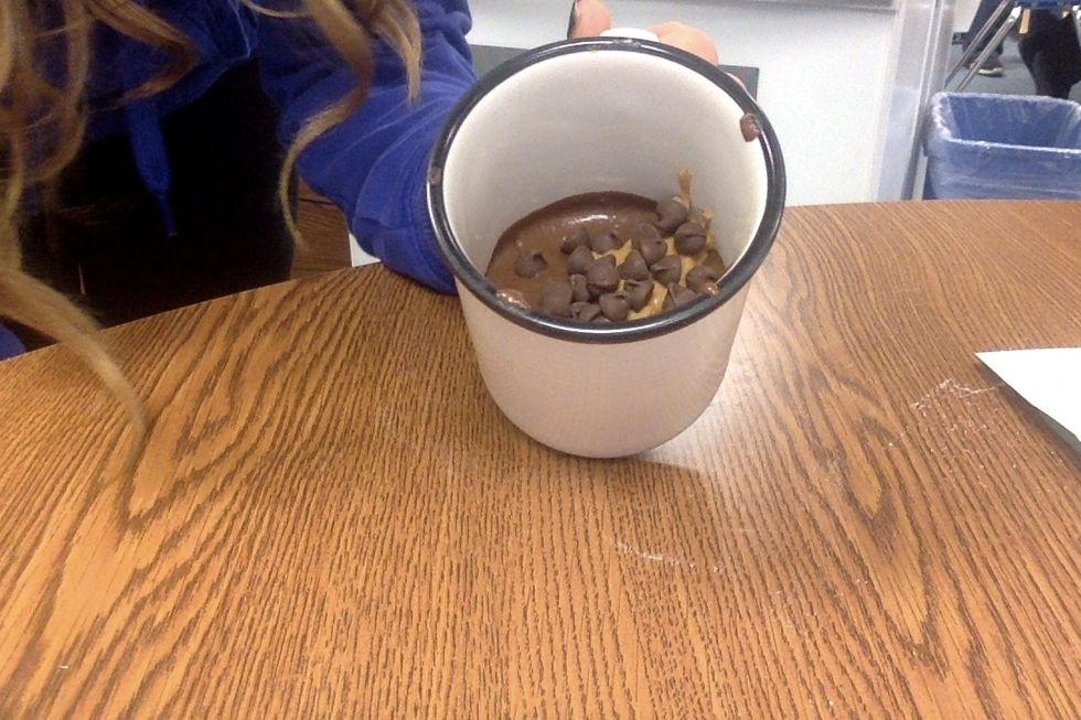 Sprinkle 1 tablespoon of mini chocolate chips. Then microwave on high for 1 minute.