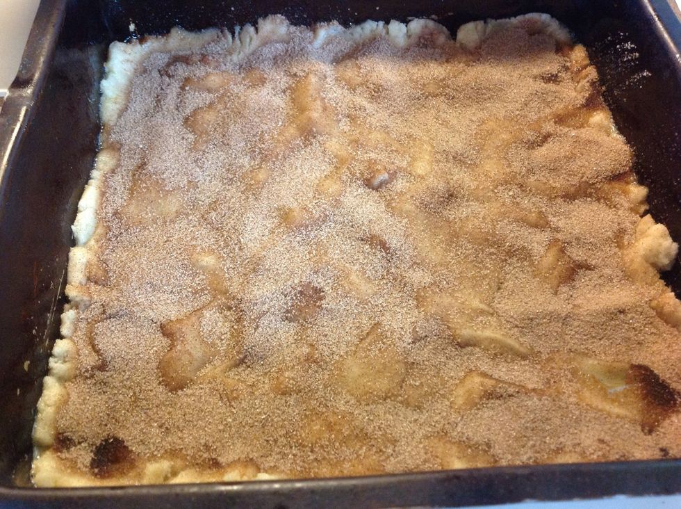 Sprinkle 2/3 of cinnamon sugar over the cookie dough.