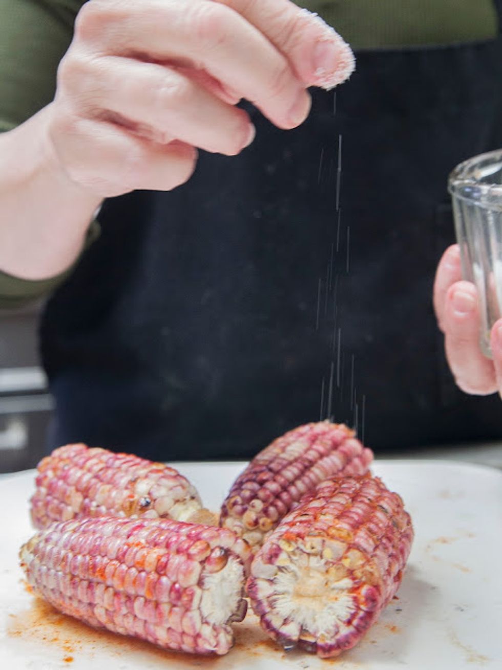 Sprinkle a bit of salt on the ears of corn.