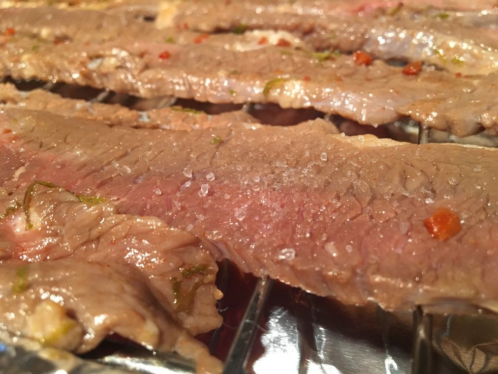 Sprinkle a good amount of coarse salt over your brisket before cooking to help dry out and give flavour